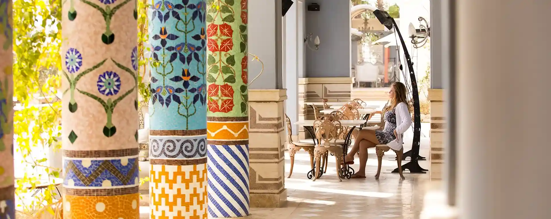 Women enjoying a scenic setting at La Maison Bleue el Gouna, immersed in the tranquil atmosphere and stunning views.