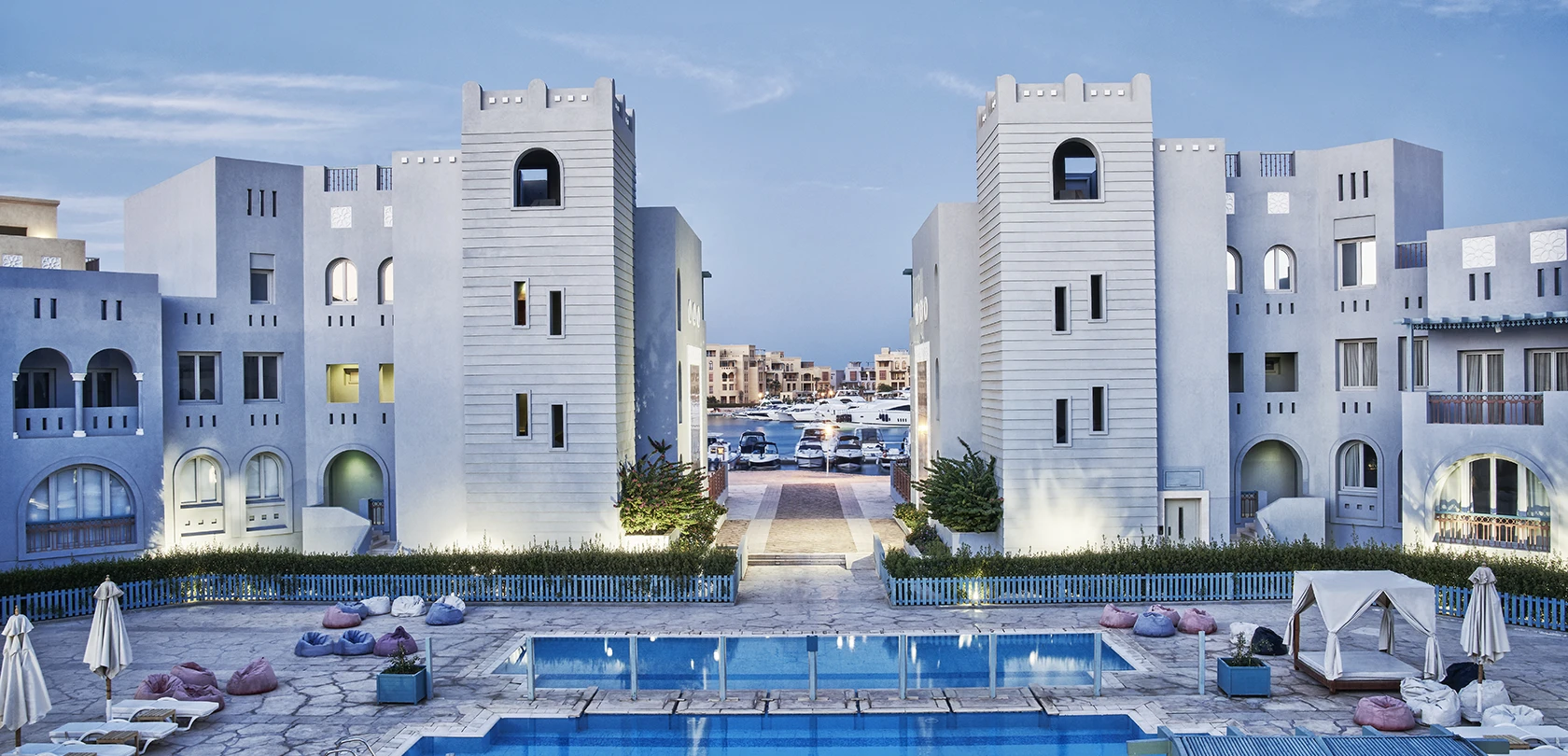 Swimming pool at Fanadir El Gouna, Red Sea, Egypt, with loungers and umbrellas.