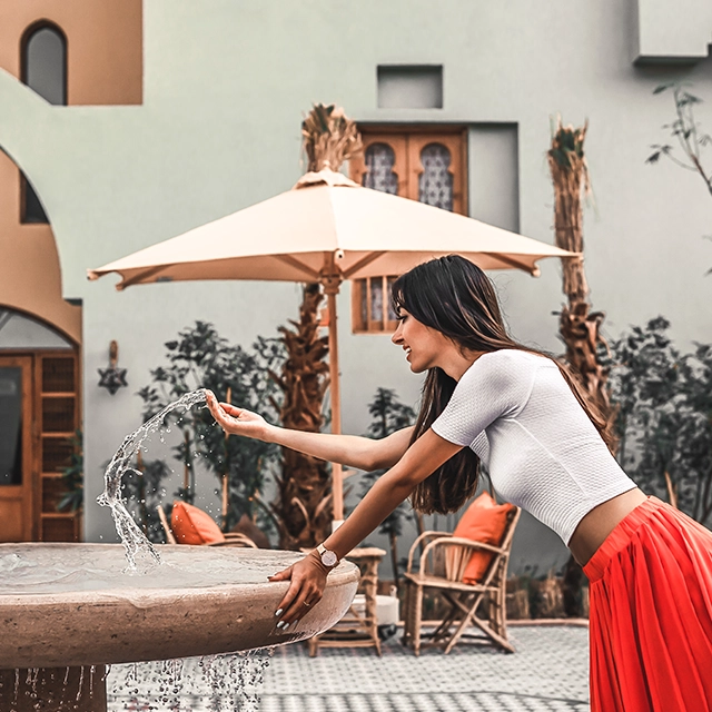 Woman in Ali Pasha Hotel Fountain