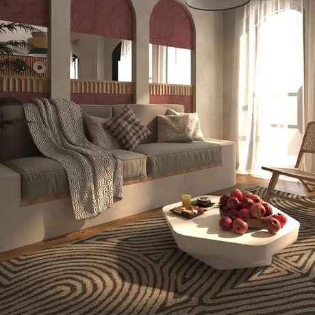 Villa Coconut featuring a king-size bed, a sofa, and a table with a fruit bowl on it. Sunlight streams through the windows, illuminating the room.