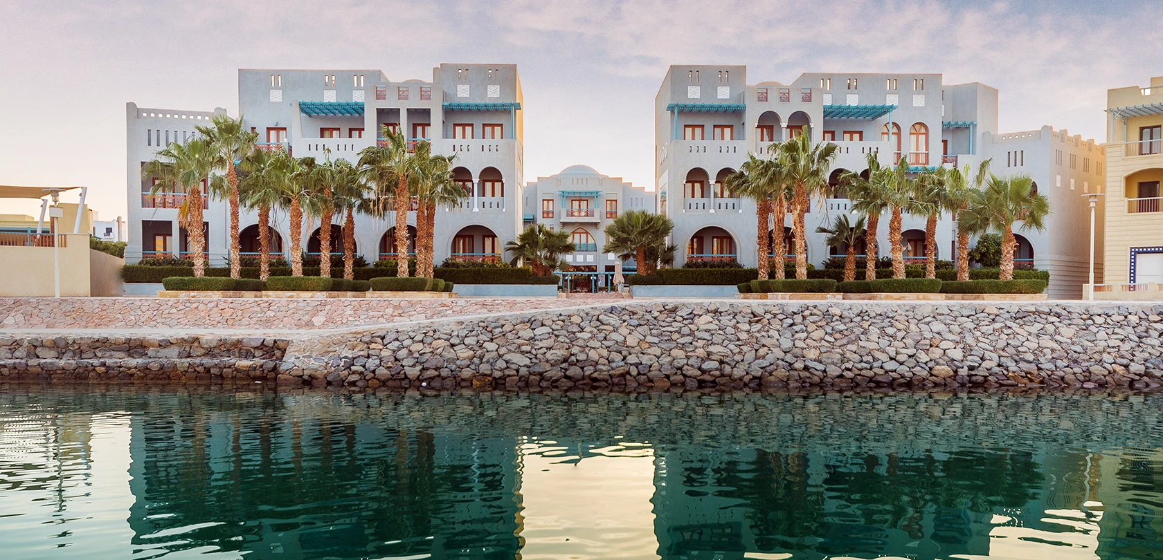 Exterior shot of Fanadir Hotel, El Gouna, showcasing its architecture and surroundings.