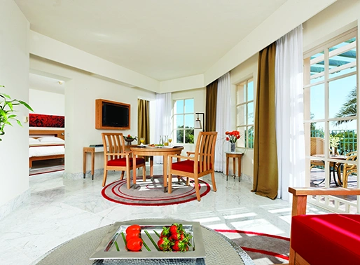A deluxe suite at Mövenpick El Gouna in the Red Sea, offering luxurious accommodations with elegant décor and premium amenities
