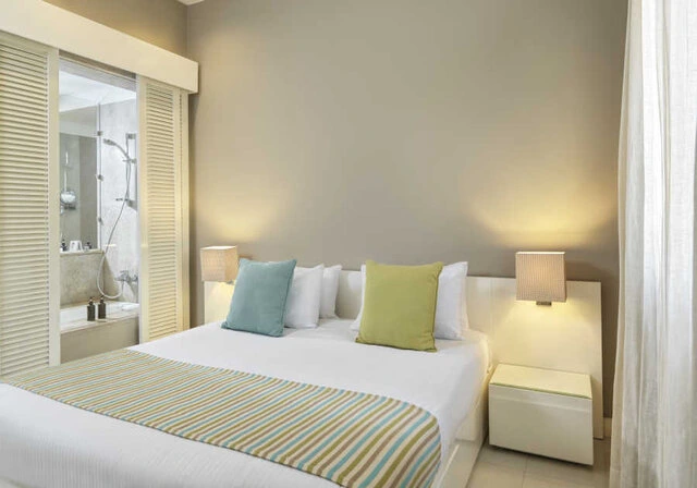 ancient-sands-hotel-el-gouna-junior-suite-king-bed-bedroom gallery 1